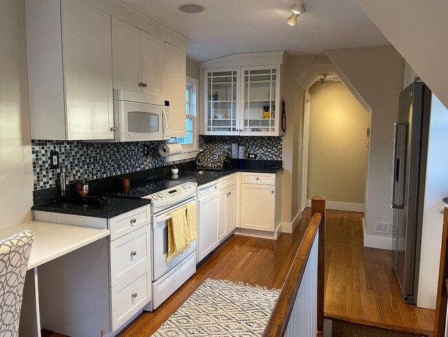 Remodeled kitchen with granite and staineless steel refrigerator - 4 Sycamore Ln