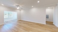 Located at 7534 Shoal Creek Way in Knoxville, Tennessee, this single-floor, 2-bedroom, 2-bathroom home offers a clean, modern aesthetic throughout. Light hardwood flooring flows seamlessly across every room, lending a bright and cohesive feel to the entire space.

The open-concept kitchen and living area serves as the heart of the home. The kitchen is equipped with white shaker cabinetry, granite countertops, stainless steel appliances including a refrigerator, electric range, and microwave, and a central island with pendant lighting overhead — ideal for both cooking and casual dining. The adjacent living room features crown molding, recessed lighting, and a ceiling fan, creating a comfortable and well-lit gathering space.

The generously sized primary bedroom includes a ceiling fan and ample room for furnishings, accompanied by a walk-in closet fitted with wire shelving systems for organized storage. The primary bathroom features a granite-topped vanity with modern hardware. A second bedroom of comfortable proportions also includes a ceiling fan and closet access. The second bathroom mirrors the refined finishes found throughout, with a granite vanity and light hardwood flooring. A connecting hallway ties all rooms together efficiently, completing this thoughtfully designed, move-in-ready home.