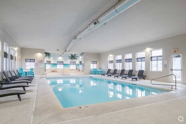 Our clubhouse includes an indoor clubhouse for year-round swimming. - Cascade Pines Duplexes