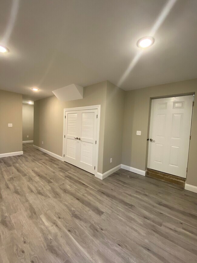 Living room space with washer and dryer room - 68 W 52nd St