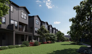 Oxenfree Clear Creek townhomes lining the amenity lawn. - Oxenfree Clear Creek
