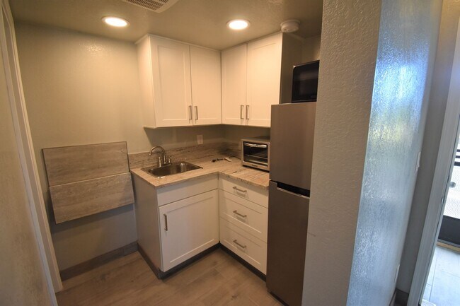 Building Photo - Studio with Private Parking, Patio, Laundr...
