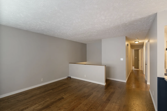 Upper Level Living Room + Hallway to Bedrooms - 1411 Chadwick Dr