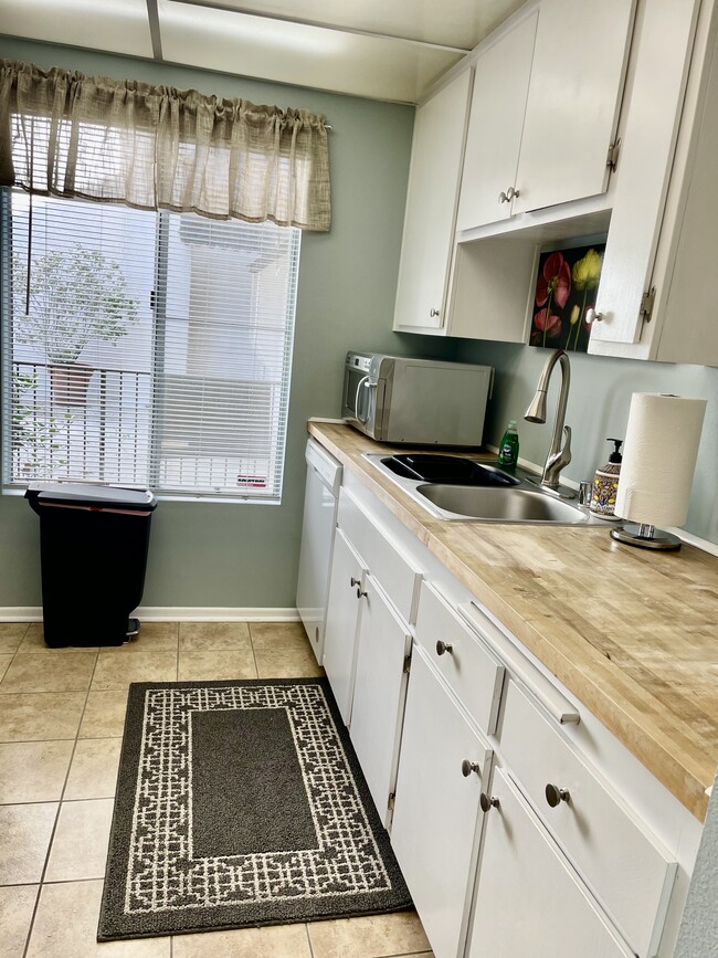 Butcher block counter tops and lots of light. - 4111 Summertime Ln