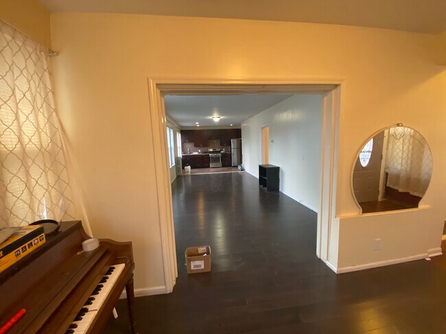 Front room view of living room and kitchen - 319 Beach 70th St