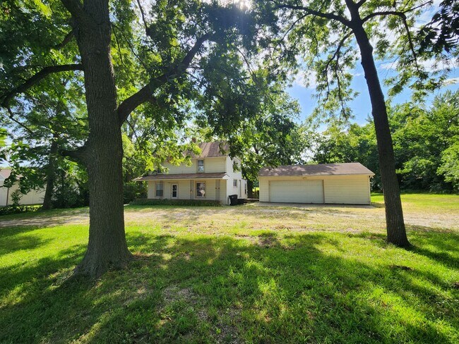 Building Photo - Nice home with oversized 2car gar with work bench and large shaded yard. Country-like setting