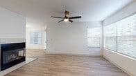 Located at 1658 S Hiawassee Rd in Orlando, FL, this single-floor residence offers a clean, modern interior designed for comfortable living. The main living area features light wood-style flooring that flows throughout, a tile-surround fireplace as a focal point, and a ceiling fan overhead. Multiple windows dressed with horizontal blinds fill the space with natural light, creating a bright and airy atmosphere. A glass-paneled exterior door provides additional light and outdoor access.

The kitchen is well-appointed with white cabinetry, white quartz-style countertops, a subtle tile backsplash, and a full suite of stainless steel appliances including an electric range, over-the-range microwave, and dishwasher. The bedroom features plush carpeting, a ceiling fan, and a large window with views of the surrounding greenery, offering a comfortable and restful environment. Louvered closet doors provide ample storage.

The bathroom is finished with wood-style flooring, a large vanity mirror, taupe cabinetry with brushed nickel hardware, white countertops, and a full tub-shower combination. Throughout the unit, the neutral color palette and consistent finishes create a cohesive, move-in-ready environment suited for a variety of lifestyles.