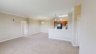 Located at 1300 Lovell Crossing Way in Knoxville, TN, this single-floor, three-bedroom, two-bathroom home offers a well-designed layout with a comfortable and functional living environment. The open-concept kitchen is a standout feature, showcasing warm honey-toned wood cabinetry, white countertops, black appliances including an electric range and built-in microwave, a stainless steel refrigerator, and a peninsula with a double sink illuminated by pendant lighting — ideal for both cooking and casual dining. Crown molding accents the kitchen and dining areas, adding a refined touch throughout.

The living room is bright and welcoming, featuring neutral carpet, a large window that invites natural light, and direct access to the front entry. Each of the three bedrooms is carpeted and finished with neutral tones, offering a calm and restful atmosphere. The spacious primary bedroom includes crown molding and a generously sized closet with bi-fold doors. The two bathrooms each feature a full tub and shower combination with clean, white tile surrounds and hardwood-style flooring. Additional closets provide practical storage throughout the home, completing this well-rounded residential space.