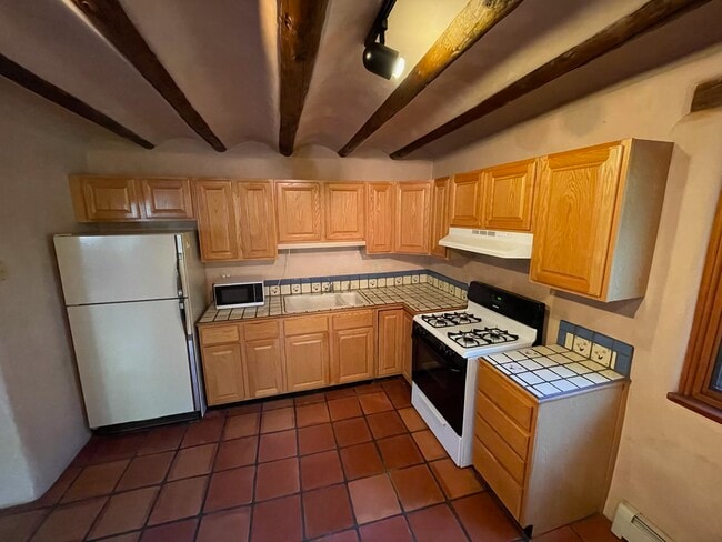 Kitchen with gas stove (new stainless fridge not pictured) - 1470B Bishops Lodge Rd