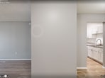Located at 600 Starkey Rd in Largo, FL, this 1-bedroom, 1-bathroom apartment offers 640 square feet of thoughtfully designed single-floor living. Throughout the unit, light wood-look flooring and neutral gray walls create a clean, cohesive aesthetic complemented by textured ceilings.

The open-concept living room is a highlight of the unit, featuring a sliding glass door with vertical blinds that floods the space with natural light and provides outdoor access. The living area flows seamlessly into the combined kitchen and dining space, where white shaker cabinetry, granite-look countertops, a white subway tile backsplash, and a stainless steel double-basin sink create a modern and functional kitchen. A black electric range, over-the-range microwave, and an in-unit washer are also included.

The 140-square-foot bedroom offers a window with natural light and connects to a dedicated closet and hallway. The full bathroom features a marble-look vanity countertop with white cabinetry, a tub-shower combo, wood-look flooring, and brushed gold fixtures, contributing a refined touch to the space. A hallway connects all rooms efficiently, maximizing the use of the available floor plan.