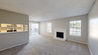 Located at 681 N Saginaw Blvd in Saginaw, TX, this single-story, one-bedroom, four-bathroom home offers a thoughtfully organized layout with a comfortable, neutral aesthetic throughout. The open-concept living and dining area serves as the heart of the home, highlighted by a white brick-surround fireplace and plush carpet flooring. Multiple windows flood the space with natural light, while sliding glass doors lead to an outdoor balcony, further enhancing the bright and airy atmosphere. The galley-style kitchen features white shaker cabinetry, light stone countertops, stainless steel appliances including a refrigerator and electric range, and durable wood-look vinyl flooring — offering both style and function. The bedroom is generously sized, equipped with a ceiling fan and a large window, and benefits from ample closet space, including a spacious walk-in closet with built-in shelving and rod systems. The bathrooms are cleanly finished with white vanities, stone countertops, tiled tub-shower combinations, and wood-look vinyl flooring. A dedicated laundry area and additional closets throughout add to the home's practical storage capacity. Textured ceilings and soft, neutral wall tones create a cohesive and move-in-ready environment.