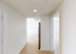 Located at 1500 NE Miami Place in the heart of Miami, FL, this contemporary high-rise unit offers a sleek, modern living experience with clean lines and a bright, open aesthetic throughout. Light wood-style flooring flows seamlessly across the entire space, complementing the crisp white walls and creating a warm, cohesive atmosphere.

The open-concept living area is anchored by large sliding glass doors that flood the room with natural light and provide direct access to a balcony with sweeping views of the surrounding cityscape. The kitchen features flat-panel taupe cabinetry, granite countertops, and a full suite of stainless steel appliances, including a refrigerator with ice maker, electric range, microwave, and dishwasher.

Multiple bedrooms benefit from generous floor-to-ceiling windows that frame striking views of the Miami skyline and Biscayne Bay, filling each room with abundant natural light. The bathrooms are finished with large-format marble-style porcelain tile, a wood-toned vanity with granite countertops, and a soaking tub with elegant marble-surround tile walls. A stacked in-unit washer and dryer is conveniently tucked behind louvered closet doors. Recessed lighting and modern HVAC complete this well-appointed urban residence.