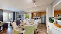 Located at 7777 Westside Drive in San Diego, CA, this thoughtfully designed 2-bedroom, 2-bathroom residence offers a comfortable and modern living experience across a single floor. The open-concept kitchen and living area serves as the heart of the home, featuring warm wood-tone cabinetry, stainless steel appliances, pendant lighting, and a seamless flow into the dining space — ideal for everyday living and entertaining. Wood-style flooring runs throughout the main living areas, adding warmth and continuity. The living room is bright and inviting, with French doors that open onto a private balcony, bringing in natural light and outdoor views of the surrounding landscaping. The primary bedroom is generously sized with plush carpet, a large window framing palm tree views, and a walk-in closet with ample shelving and hanging storage. The second bedroom is equally comfortable, also finished with carpet and well-suited for guests or a home office. Both bathrooms are finished with wood-style flooring; one features a full tub-shower combination. A connecting hallway ties the layout together efficiently, and two closets provide practical storage throughout. The overall aesthetic is clean, contemporary, and cohesive — a refined residence in the heart of San Diego.