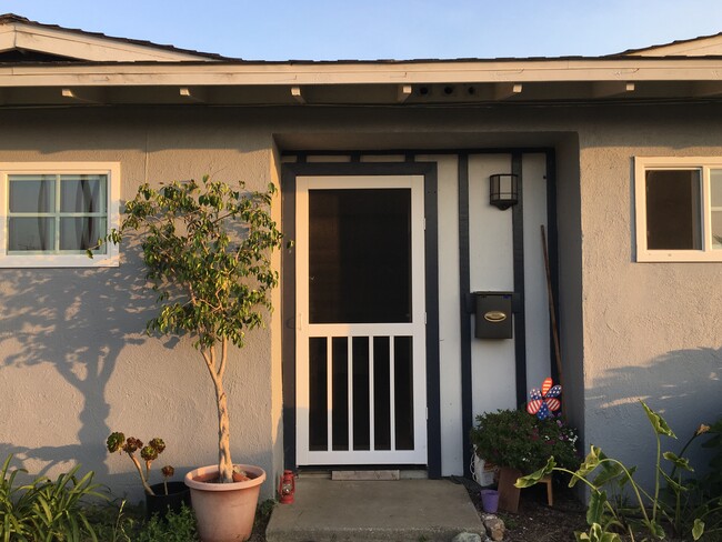 Vinyl screen door for naturally cooling the unit - 400 East Airport Avenue