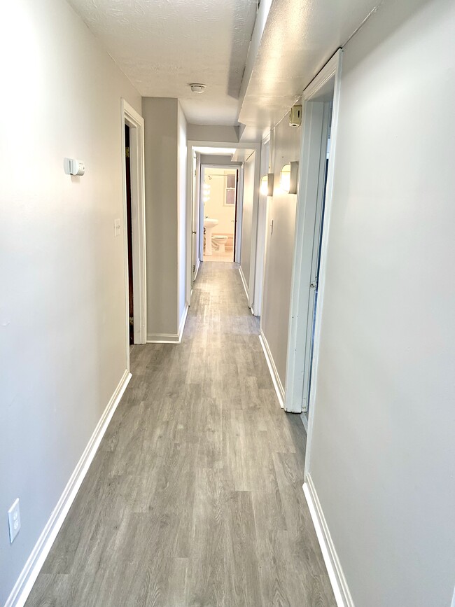 Hallway from liv rm to bath - 7609 Hamilton Ave