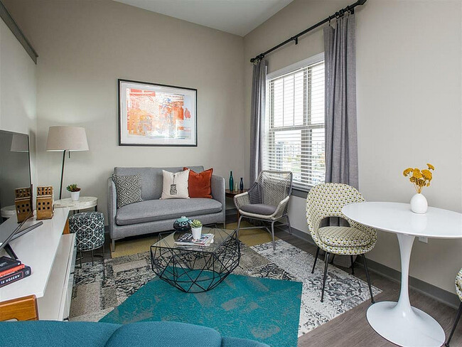 Experience comfort and style in this beautifully decorated urban living room. - Eastside Heights