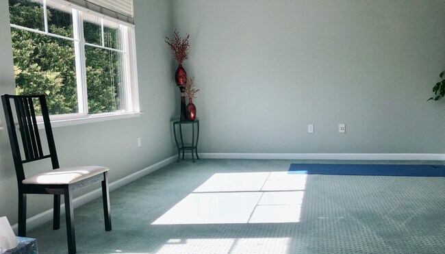 West facing large windows in the living room. - 757 Seneca Ter
