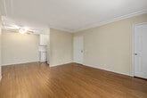 Located at 8180 Genesee Ave in the University City neighborhood of San Diego, California, this single-floor residence offers a clean, well-maintained living environment with a cohesive design throughout. Warm hardwood-style flooring runs consistently across the main living areas and bedrooms, creating a unified and inviting atmosphere.

The open living and dining area is highlighted by crown molding, a ceiling fan, and a neutral color palette that lends the space a bright, airy feel. A dedicated area features elegant French doors that allow natural light to pour in and provide direct access to the outdoors. The bedrooms are generously proportioned, each with hardwood-style flooring, ample wall space, and window treatments providing privacy and light control.

The kitchen is efficiently laid out in a galley configuration, featuring white cabinetry extending to the ceiling for abundant storage, light countertops, a built-in microwave, electric range, dishwasher, and a full-size refrigerator — all finished in white for a clean, cohesive look. The bathroom is well-appointed with a full tub-shower combination, a large vanity mirror, white cabinetry, and neutral tile flooring. Throughout the residence, consistent finishes and thoughtful details contribute to a comfortable, move-in-ready living space.