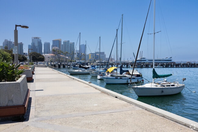 Harbor Drive offers scenic bay views with benches, parking, and walking paths in Little Italy.