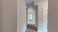 Located at 111 Cheswick Cir in Yorktown, Virginia, this single-story, 3-bedroom, 2-bathroom home offers a thoughtfully designed layout that maximizes functionality and comfort. The interior is finished with neutral tones throughout, creating a clean and versatile living environment.

The kitchen stands out with rich cherry-toned cabinetry, granite countertops, and light tile flooring, lending a warm yet polished feel to the space. It connects seamlessly to a dedicated dining room and is complemented by an adjacent pantry for generous storage. A dedicated laundry area adds everyday convenience.

The living room provides a comfortable gathering space, while the hallway connects the private areas of the home with a carpeted corridor fitted with ceiling-mounted lighting. The three bedrooms are finished with plush carpet, neutral walls, and ceiling fans, with natural light entering through windows dressed with blinds. Each bedroom includes closet access, and the primary bedroom offers direct entry to its own bathroom. With eight closets throughout, storage is abundant.

The two bathrooms are finished with tile flooring and feature tub-shower combinations with brushed nickel fixtures. One bathroom showcases a rich wood vanity with granite countertops, echoing the kitchen's design language. Overall, the home presents a cohesive, move-in-ready interior with practical amenities throughout.