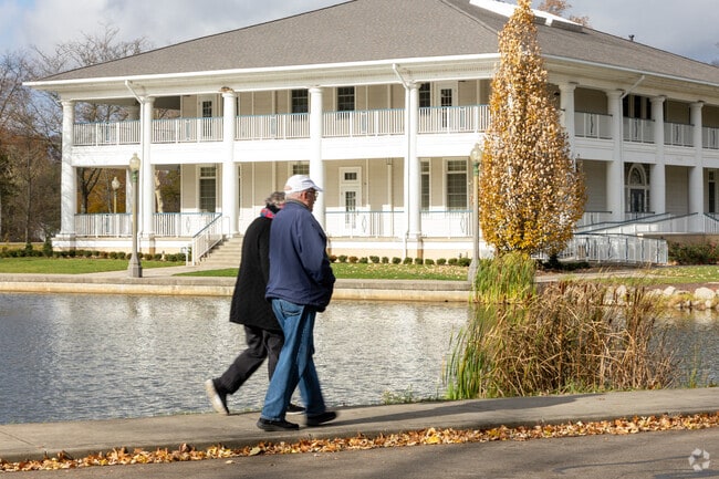 A couple strolls down the street on a brisk day in Hermitage.