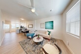 Located at 3501 Harbison Dr in Vacaville, California, this thoughtfully designed three-story home offers 2 bedrooms and 4 bathrooms across well-distributed living space. The ground floor features a private garage with ample room and direct interior access via a clean, light-filled hallway with light wood-look flooring and a wall-mounted mirror.

The main living level serves as the heart of the home, showcasing an open-concept layout that seamlessly connects the living room, dining area, and kitchen. The living room is bright and airy, equipped with a ceiling fan, light wood flooring, and large windows that invite natural light. Pendant lighting anchors the dining area, which flows naturally into the kitchen. A convenient half bathroom with a pedestal sink and window is also found on this floor.

The upper level hosts both bedrooms, including a generously sized primary bedroom featuring a large picture window with neighborhood views, a ceiling fan, and a dedicated closet. The additional bedrooms and bathrooms are well-appointed with clean, modern finishes. Full bathrooms include tub-shower combinations with white subway tile surrounds and floating vanities. A versatile landing area on the top floor provides flexible use as a reading nook or home office. The patio adds an outdoor retreat, completing this well-rounded, multi-level home.