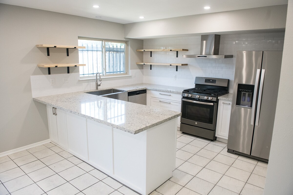 brand new kitchen featuring exposed shelving, gas range, and farmhouse sink - 2370 Triway Ln