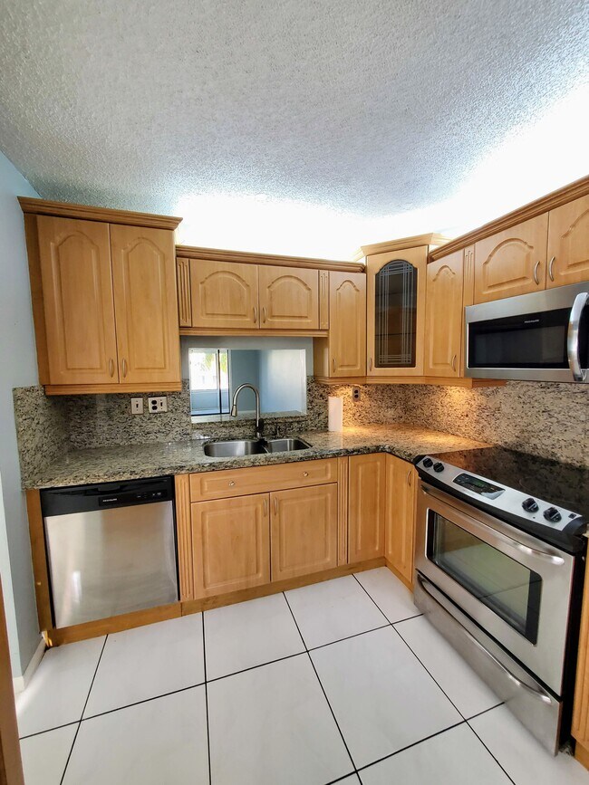 Kitchen with stainless steel appliances - 1820 N Lauderdale Ave