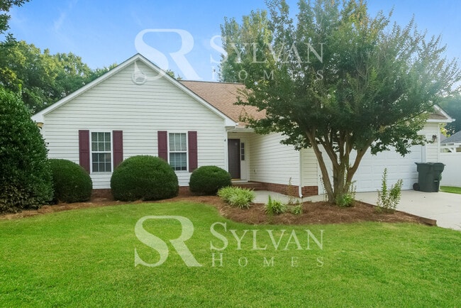 Building Photo - This home exudes a cheerful and welcoming charm!