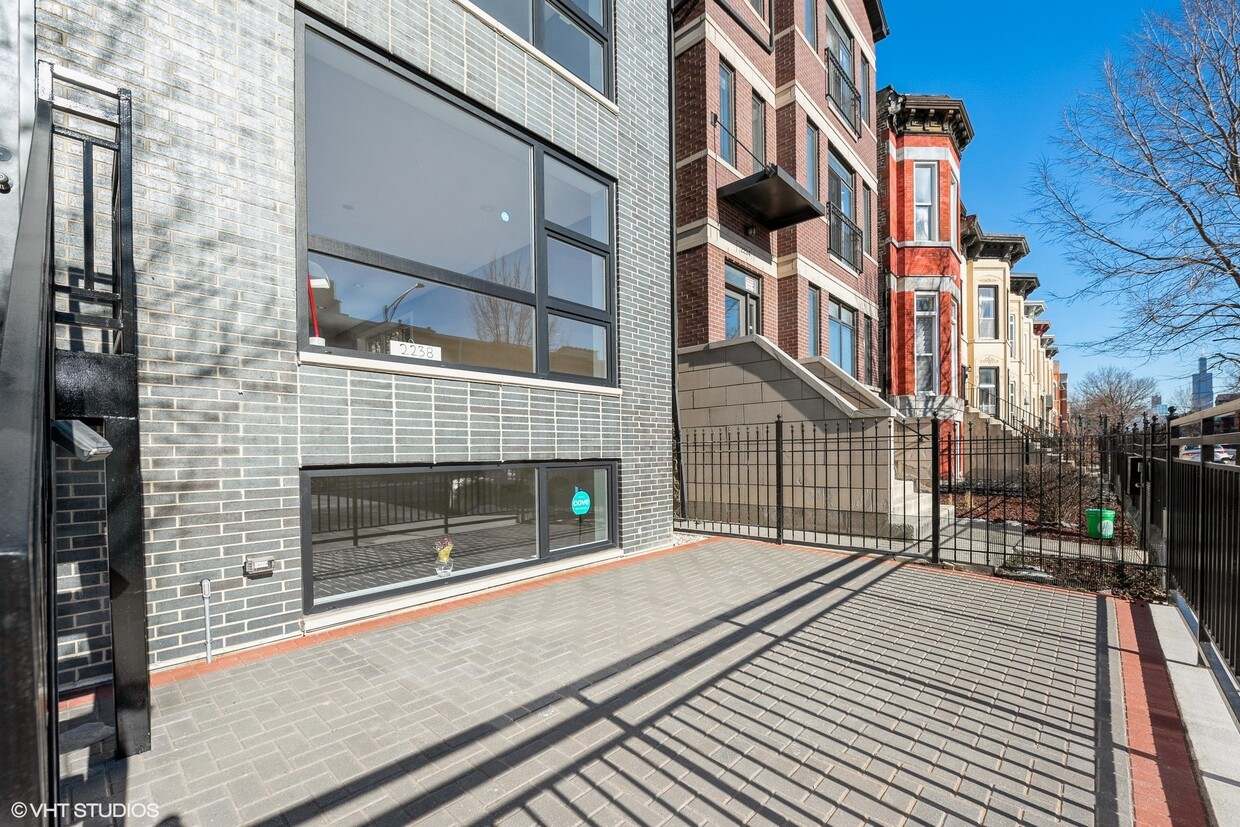 Front facade and front bricked enclosedpatio - 2238 W Warren Blvd