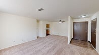 Located at 3300 E Kimberly Rd in Davenport, Iowa, this one-bedroom, one-bathroom unit offers a well-organized single-floor layout designed for comfortable everyday living. The living room serves as the heart of the unit, featuring neutral-toned carpet, a ceiling fan with light fixture, a textured ceiling, and a front entry door — creating an open and functional gathering space. Natural light filters in through vertical-blind-covered windows, lending a bright and airy feel throughout.

The kitchen is positioned just off the living area and features warm oak cabinetry, a double-basin stainless steel sink, laminate countertops, a white range, and dishwasher. Wood-look vinyl flooring runs through the kitchen and bathroom, providing a clean contrast to the carpeted areas.

The bedroom is a generously sized room with plush carpet, a large window with horizontal blinds offering views of the outdoors, and a full-width sliding closet with wood-panel doors — providing ample storage. The bathroom includes a vanity with oak cabinetry, a countertop basin, and direct access to both the bedroom and main living areas.

Throughout the unit, neutral warm-white walls and consistent finishes create a cohesive, move-in-ready environment well-suited for a variety of living arrangements.