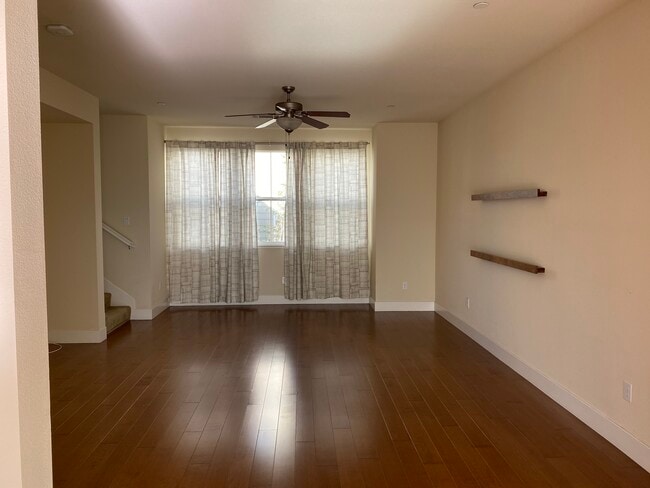 Spacious living room from the other angle, windows on both east and west sides provide great natural - 906 Arietta Dr