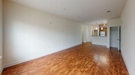 This 1000 square foot apartment offers a harmonious blend of comfort and functionality. The space is efficiently designed with two bedrooms, including a generous 210 square foot primary bedroom, and one full bathroom. The modern kitchen is a standout feature, boasting honey-colored wood cabinetry, stainless steel appliances, and elegant granite countertops. The living areas showcase a mix of warm wood flooring and plush carpeting, creating distinct zones within the open floor plan.

Natural light floods the rooms through large windows, some adorned with white blinds for privacy control. Storage solutions are abundant, with built-in closets and additional cabinet space. The bathroom features a clean, white aesthetic with a combined tub and shower unit. Neutral wall colors throughout provide a blank canvas for personalization.

The apartment's layout, as seen in the 3D floor plan, demonstrates a thoughtful arrangement of spaces, ensuring a smooth flow between rooms. This property, located at 901 Akin Dr in Greensboro, NC, offers a well-balanced living environment, ideal for those seeking a contemporary living space with modern amenities.