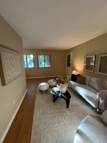 living room flooded with natural light - 3393 Madison Ave