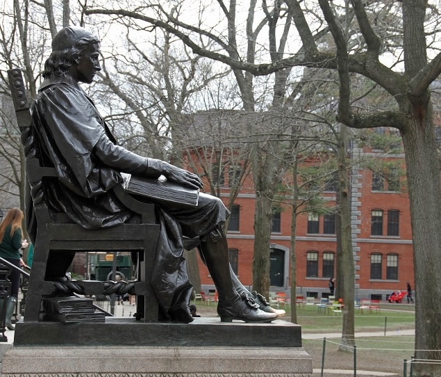 A bronze statue of John Harvard in Harvard Yard