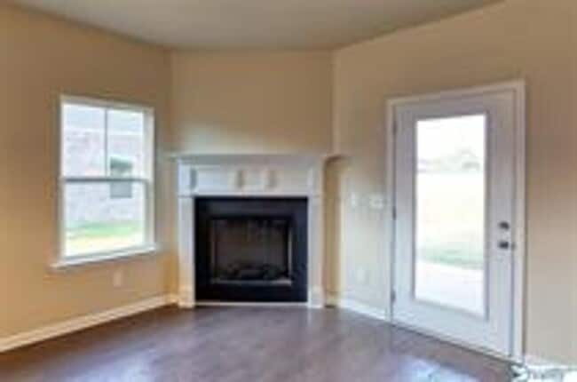 Building Photo - COMING SOON! Welcome to the Carlyle—where classic brick farmhouse charm meets a sleek, modern lif...