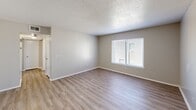 Located at 1312 N Midwest Blvd in Midwest City, Oklahoma, this 2-bedroom, 2-bathroom single-floor unit offers a functional and efficiently designed layout. Light wood-style flooring runs throughout the space, complemented by neutral warm-gray walls and textured ceilings, creating a clean and cohesive aesthetic.

The galley-style kitchen is well-appointed with rich dark wood cabinetry offering generous upper and lower storage, granite-style countertops, a double basin sink, and white appliances including a refrigerator and dishwasher. A pantry closet provides additional storage within the kitchen.

Both bedrooms are comfortably sized with natural light streaming in through sizable windows fitted with blinds. The primary bedroom includes two closets, offering ample storage. The second bedroom also features a window with an outdoor view, making it bright and welcoming.

The two bathrooms are clean and functional, each featuring tiled tub-shower combinations and vanities with dark wood cabinetry and granite-style countertops that mirror the kitchen's finishes. A hallway connects all rooms, ensuring an easy and logical flow throughout the unit. The overall ambiance is tidy, move-in ready, and well-maintained.