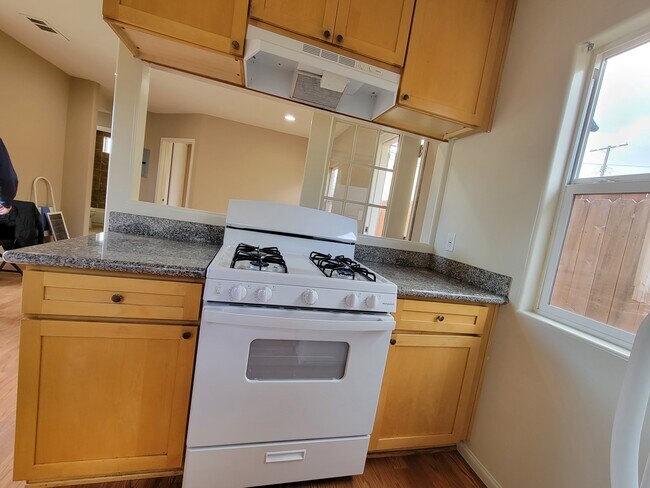 Kitchen, new stove - 7015 Louise Ave