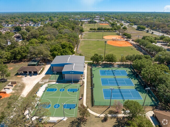 Aerial view of the basketball courts, tennis courts, and baseball fields at Red Bug Lake Park
