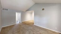 Located at 18290 Upper Bay Rd in Nassau Bay, TX, this single-story home offers four bedrooms, two bathrooms, a kitchen, and a dedicated closet. The interior is finished with a consistent soft gray color palette throughout, creating a clean and cohesive atmosphere.

The generously sized primary bedroom stands out with impressive vaulted ceilings that amplify the sense of space, plush carpeting, and a large window that draws in natural light. The remaining three bedrooms each feature ceiling fans with light kits, carpeted floors, and windows with blinds, providing comfortable and well-ventilated spaces. Several bedrooms include closets with bifold doors for convenient storage.

The kitchen is outfitted with white shaker-style cabinetry, white countertops, a stainless steel sink, a gas range, and a dishwasher. Wood-look vinyl plank flooring and a bright window overlooking the exterior give the kitchen a fresh, functional feel.

Both bathrooms are finished with white vanities, white countertops, framed mirrors, and modern brushed-nickel fixtures. The hallway bathroom features wood-look flooring that flows seamlessly into the corridor connecting the rooms.

Overall, the home presents a practical and well-maintained layout suited for comfortable everyday living in the Nassau Bay community.
