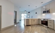 Step into a world of endless possibilities in this beautifully crafted 660 sq ft sanctuary. The open-concept living area seamlessly blends the kitchen and living room, creating an inviting space perfect for both relaxation and entertaining. The sleek kitchen boasts modern appliances, ample storage, and a stylish subway tile backsplash, inspiring your inner chef to create culinary masterpieces.

The generously sized 140 sq ft bedroom is your personal retreat, featuring plush carpeting and natural light that creates a serene atmosphere. The bathroom is a testament to contemporary design, with a glass-enclosed shower and modern fixtures that elevate your daily routine.

Throughout the home, gleaming wood-look flooring adds warmth and sophistication, while the crisp white walls provide a blank canvas for your personal style. Thoughtful details like under-cabinet lighting in the kitchen and pendant lighting add both functionality and ambiance.

This home is more than just a living space; it's an opportunity to embrace a lifestyle of comfort and convenience. The efficient layout maximizes every square foot, making organization a breeze with features like the spacious closet. Located in the desirable North Chesterfield area, you'll be perfectly positioned to enjoy all that this vibrant community has to offer.

Don't just imagine the possibilities – make them a reality in this stunning, move-in ready home. Your journey to inspired living starts here at 316 Karl Linn Dr. Welcome home to the life you've always dreamed of.