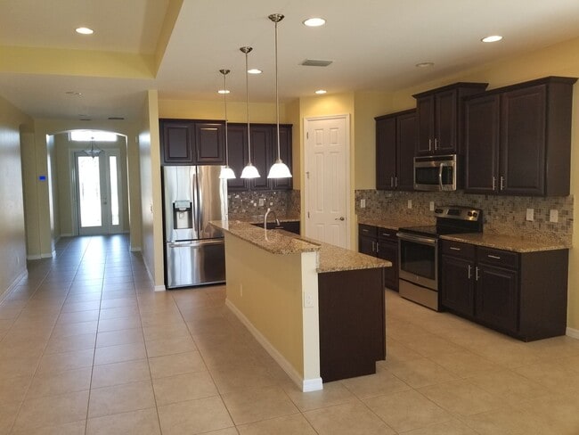 Building Photo - Celebration Cape - Gated Community - 3/2+Den/2 car garage