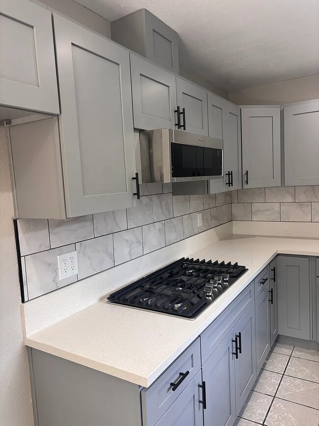 New kitchen cooktop & microwave - 131 E 82nd Pl