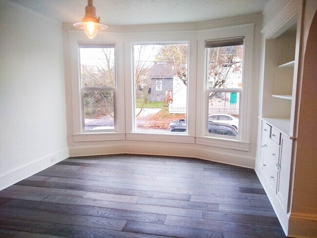 Bright living area boasting a bay windows! - 69 NE Fremont St