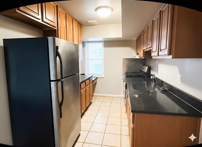 Foto del edificio - Spacious and Convenient 2-Bedroom Condo in...