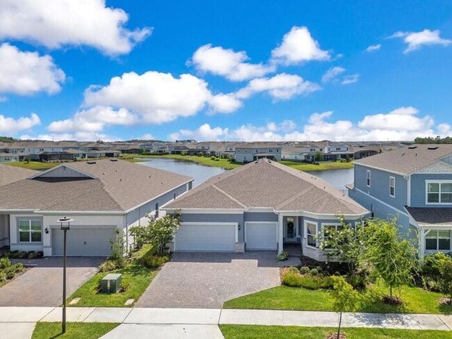 Photo - Waterfront Luxury in Isles of Lake Nona | 3-Car Garage, Resort Amenities & HOA-Included Cable, In... House