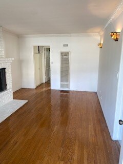 Another view of the living room with fireplace to the left. - 1859 1/2 Pandora Ave