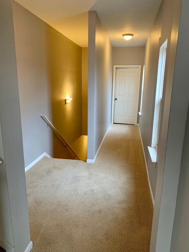 Take stairs to 2nd level hallway - 3167 Camden Dr