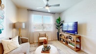 Located at 19939 Longenbaugh Rd in Houston, TX, this one-bedroom, one-bathroom residence offers a well-designed single-floor layout with a thoughtful mix of modern finishes and comfortable living spaces. Light wood-style flooring flows consistently throughout, lending a cohesive and airy feel to the entire unit.

The open-concept kitchen and living area serves as the heart of the home. The kitchen is outfitted with crisp white cabinetry, granite countertops, a grey subway tile backsplash, and a full suite of stainless steel appliances including a French door refrigerator, electric range, and built-in microwave. A peninsula provides additional counter space and casual seating. The adjacent living area benefits from a large window that brings in generous natural light, and a ceiling fan adds both function and style.

The bedroom is a calm retreat, featuring a ceiling fan, a large window with outdoor views, and direct access to the walk-in closet. The closet offers multi-tier wire shelving and hanging rods for organized storage. The bathroom is appointed with a granite-topped double vanity, white cabinetry, and a soaking tub with marble-style tile surround. Clean white walls and warm lighting complete the serene atmosphere throughout this efficiently designed residence.