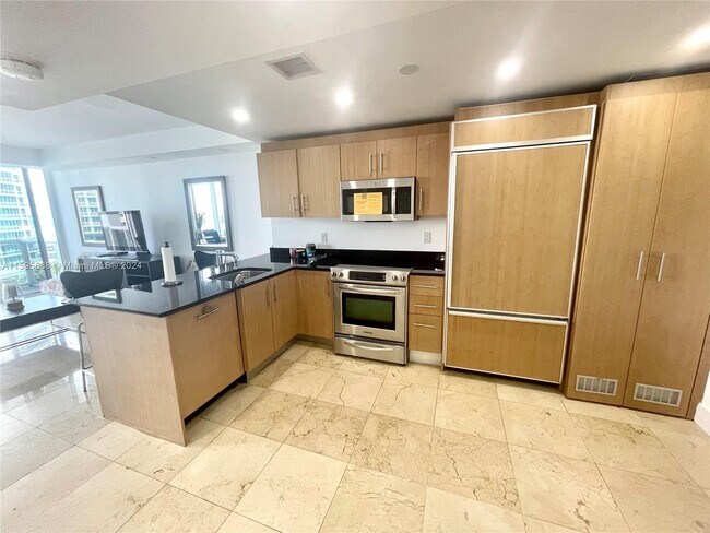 Building Photo - 10275 Collins Ave